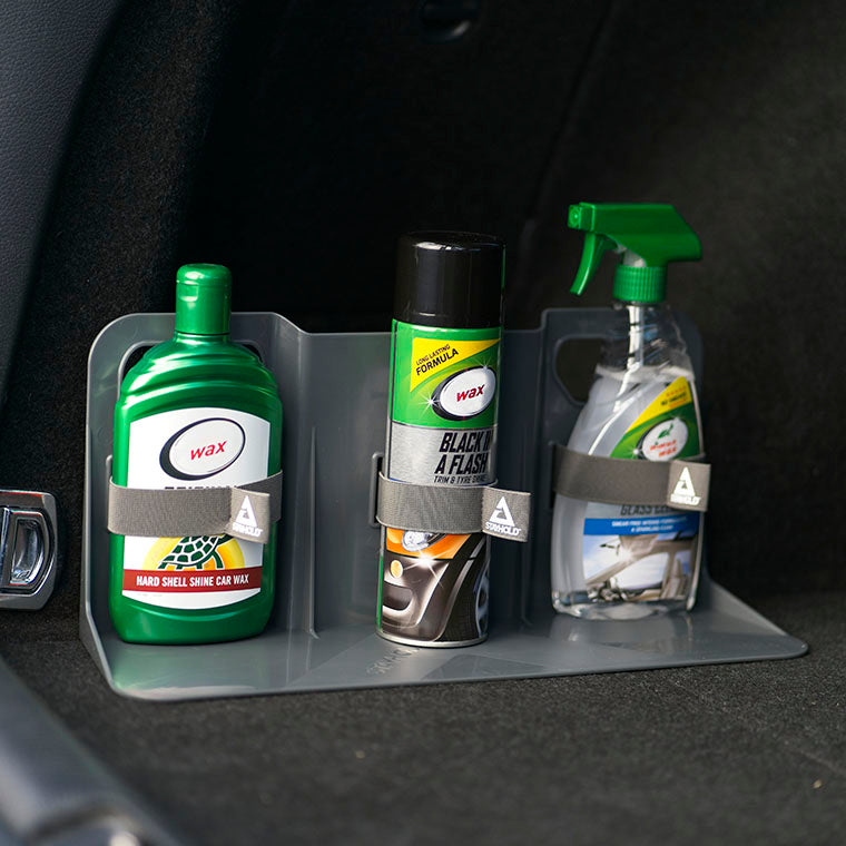 Stayhold cargo holder with straps holding bottles and sprays