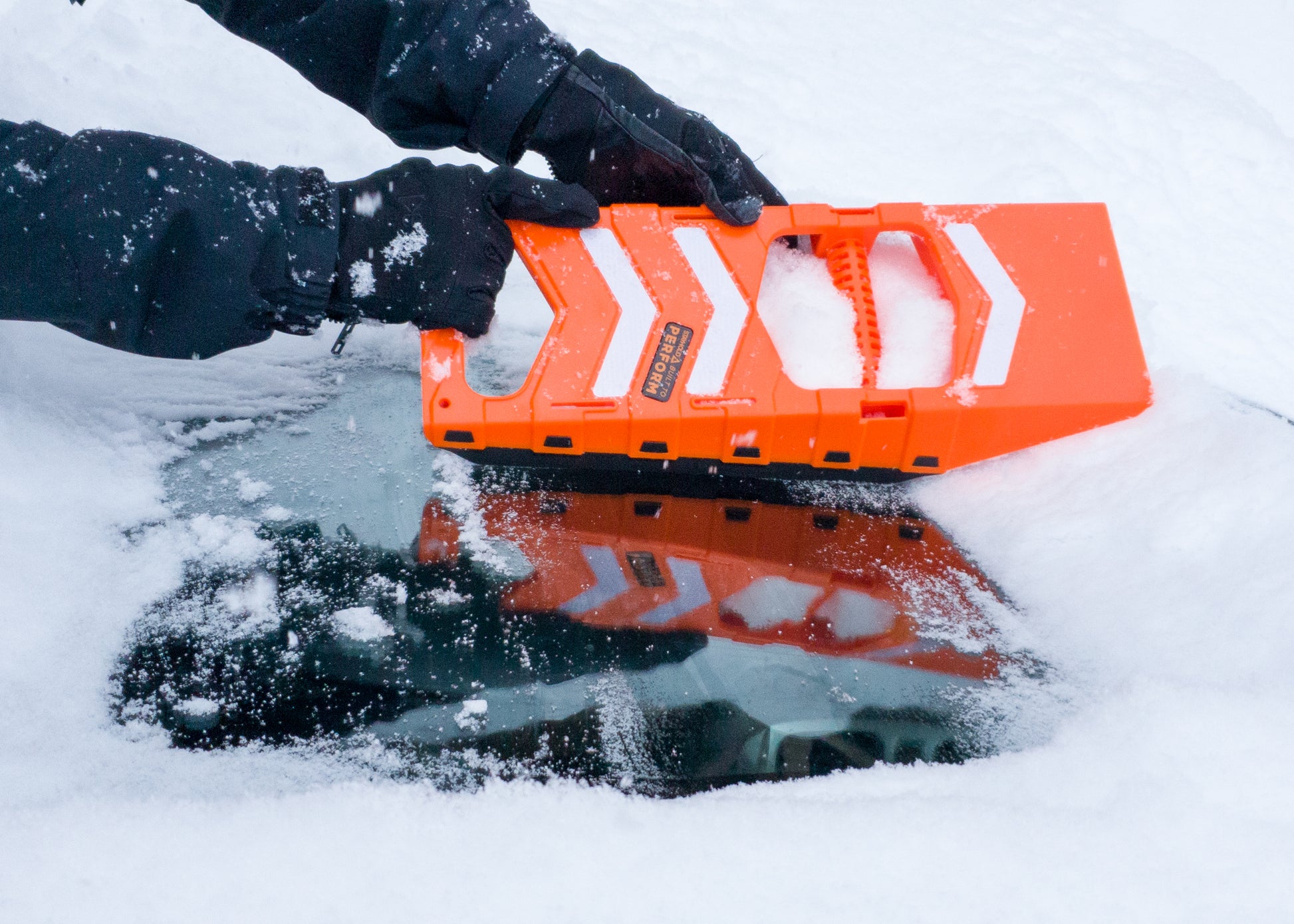 Stayhold Compact Safety Shovel clearing snow from window