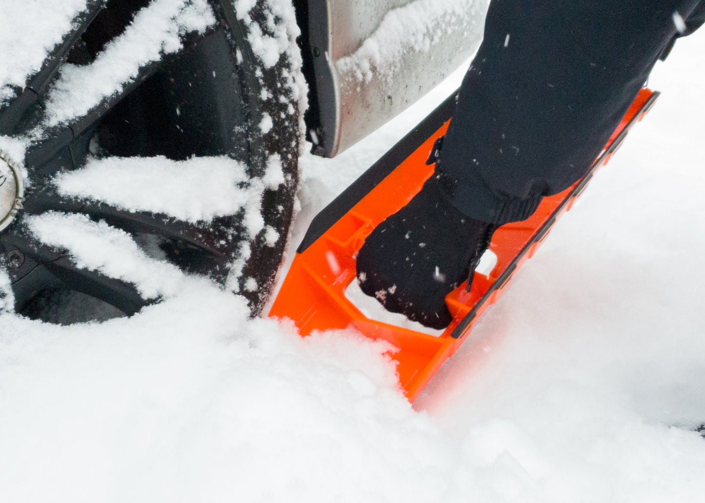 Stayhold Compact Safety Shovel clearing snow from around a car
